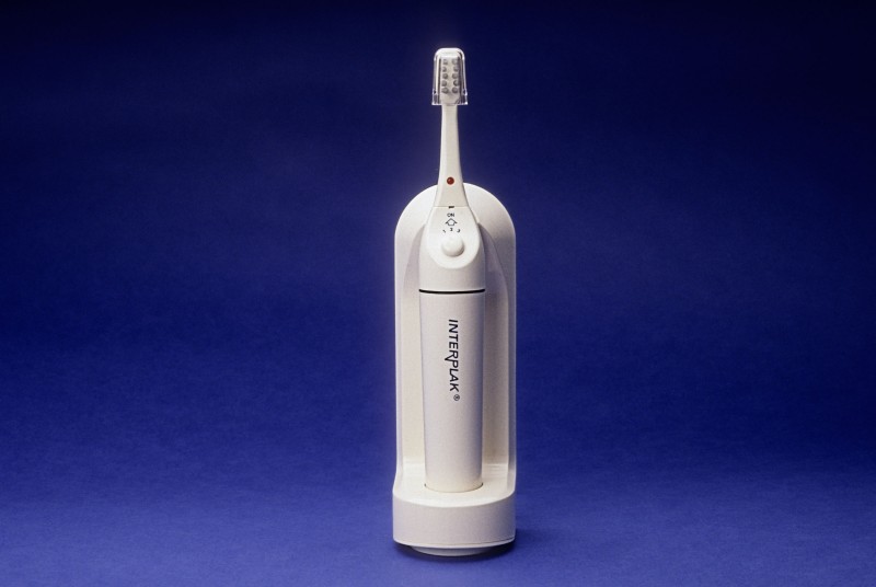 Electric toothbrush interplak developed in part by Art of Mass Production, a San Diego based plastics engineering company