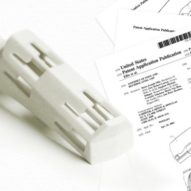 Patent and part of an electric hand saw engineered in part by Art of Mass Production, a San Diego based plastics engineering company